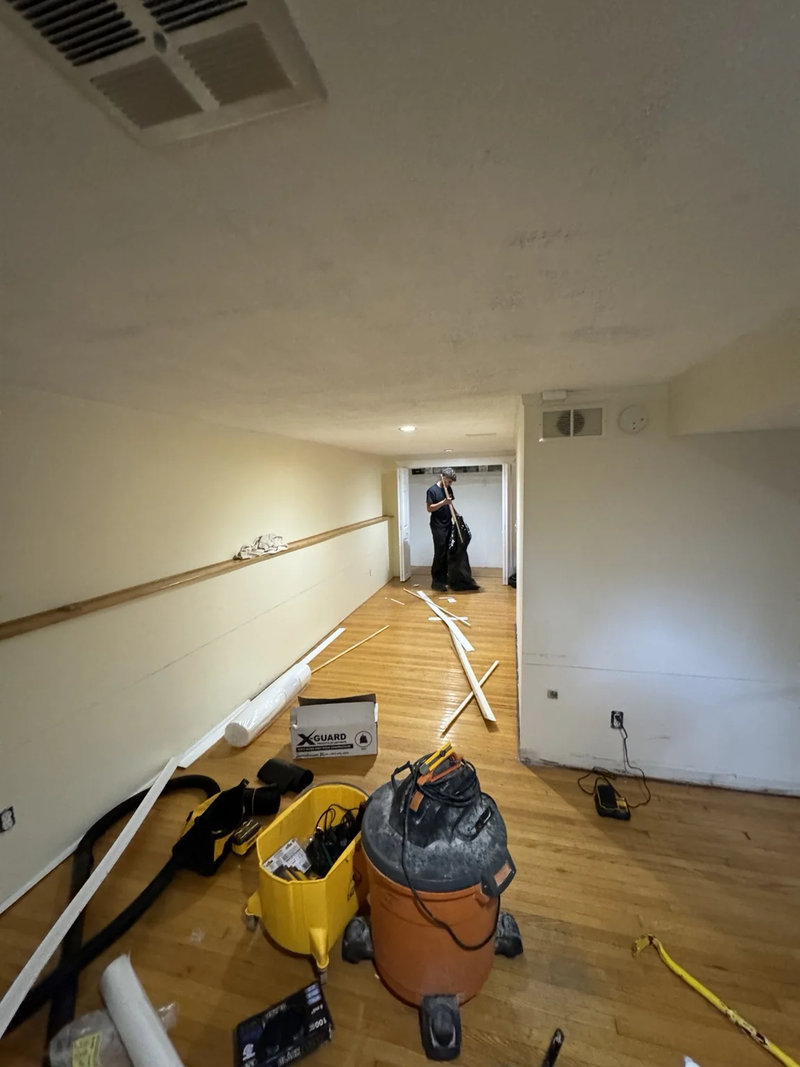 Basement work area with tools and materials during interior preparation
