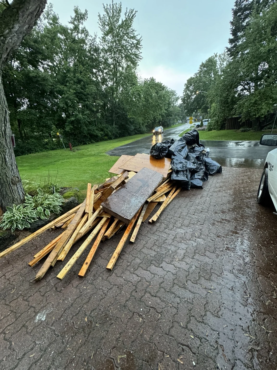 Removed timber and bagged debris staged outside during renovation
