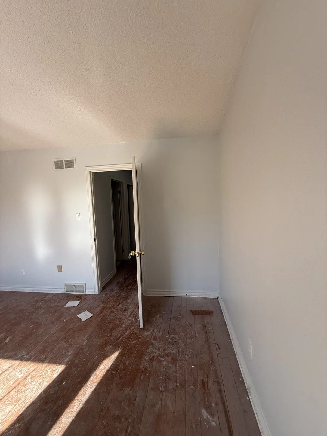 Room with existing flooring and preparation debris